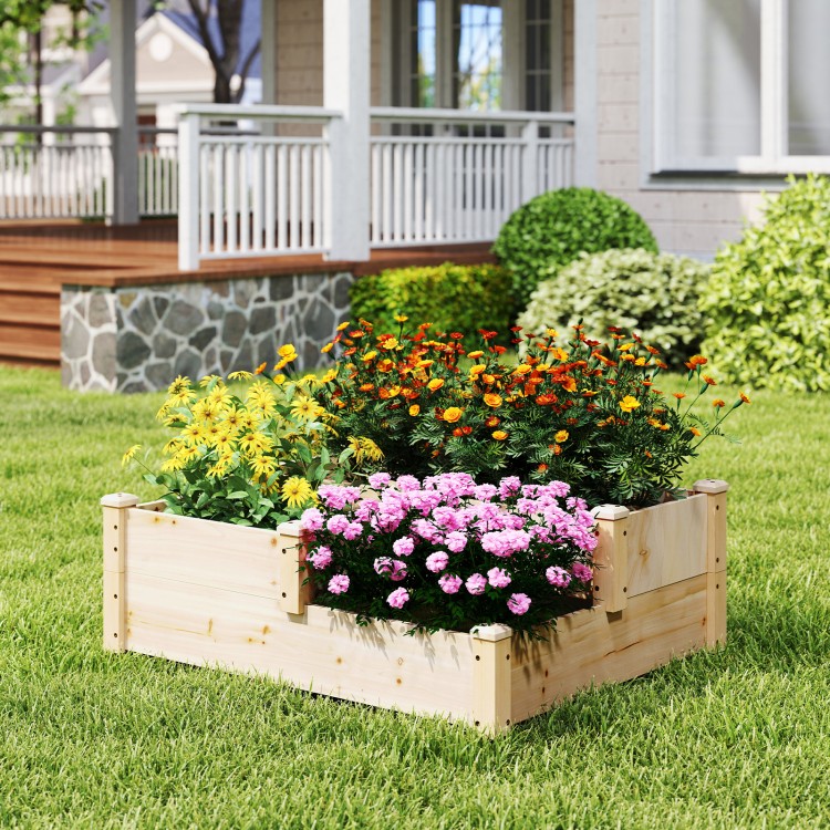 Three-tier wooden raised garden bed in natural finish, featuring vibrant flowers, ideal for gardens and balconies.
