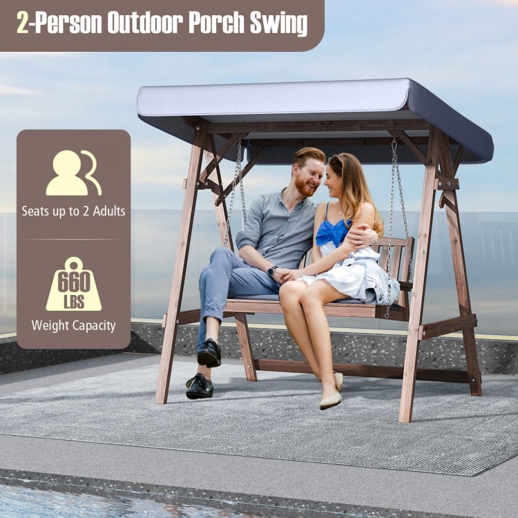 2-person porch swing with fir wood stand and tilt canopy, featuring adjustable seat height and removable cushions for.