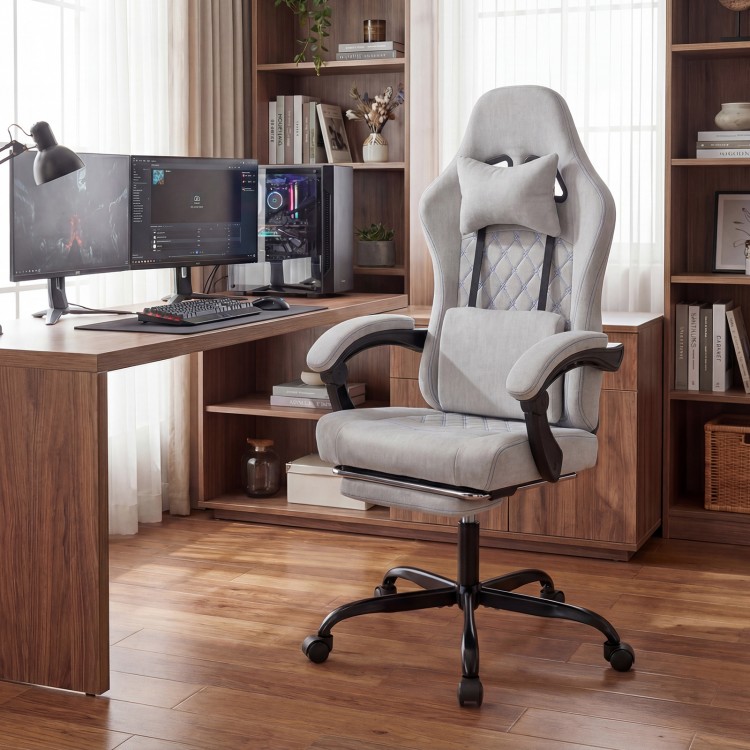 Height adjustable gray gaming chair with headrest and lumbar support, perfect for long hours of gaming or work.