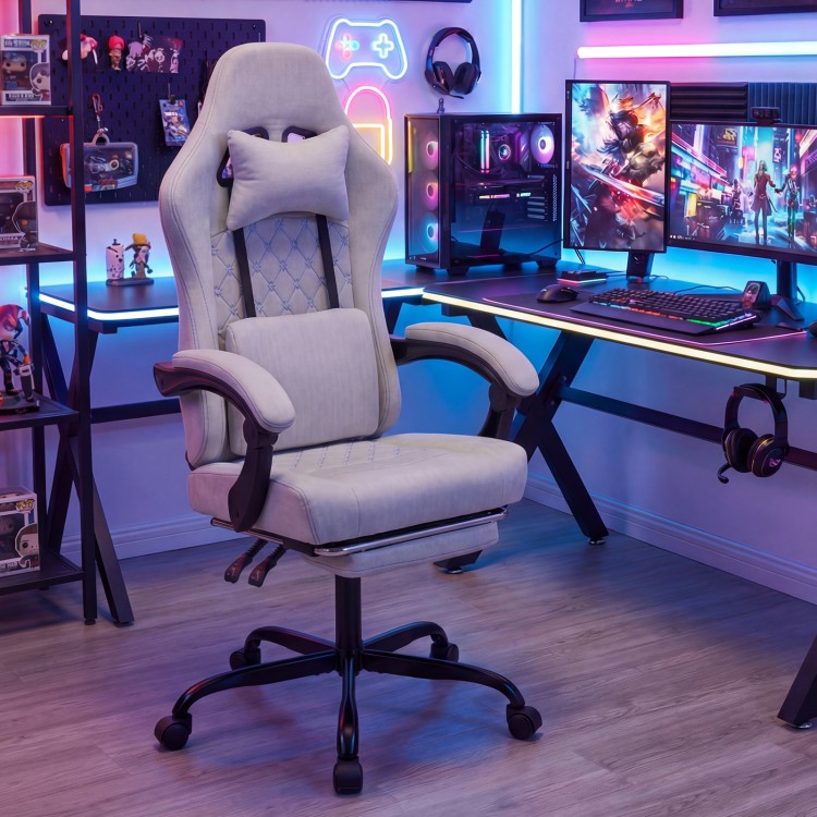 Height adjustable gray gaming chair with headrest, ergonomic design, and retractable footrest for optimal comfort.