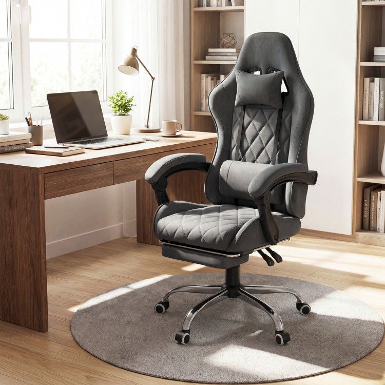 Height adjustable gaming chair in gray with headrest, lumbar support, and retractable footrest for ergonomic comfort.
