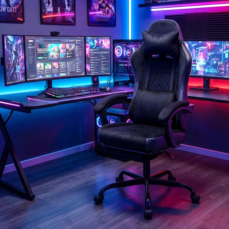 Height adjustable black gaming chair with headrest and lumbar support, designed for comfort during long gaming sessions.