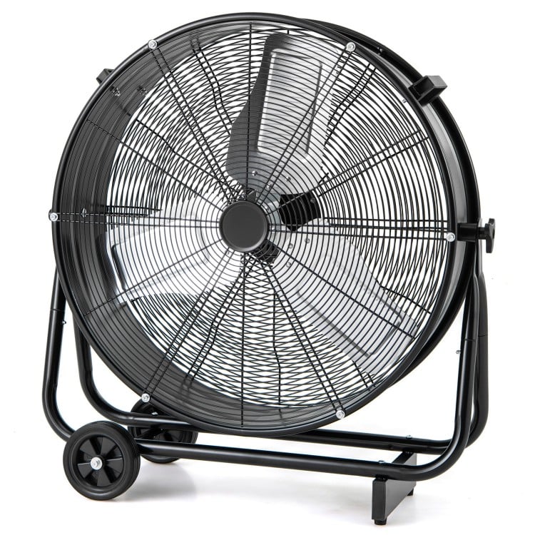 Industrial drum fan with a sturdy black frame, designed for ventilating large spaces and improving air quality.