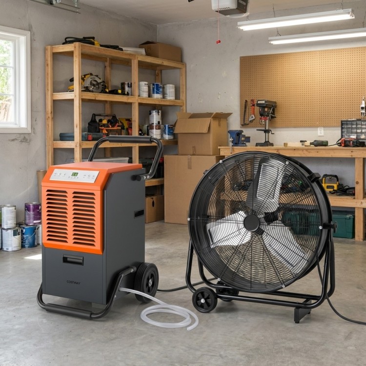 Dehumidifier and industrial drum fan for climate control in garages and workshops, enhancing air quality and cooling.