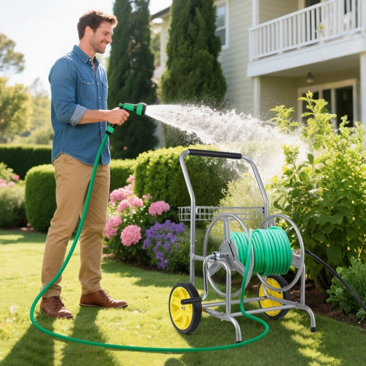 Garden hose reel cart with 2 wheels, storage basket, and foam-padded handrail for easy maneuvering in the garden.