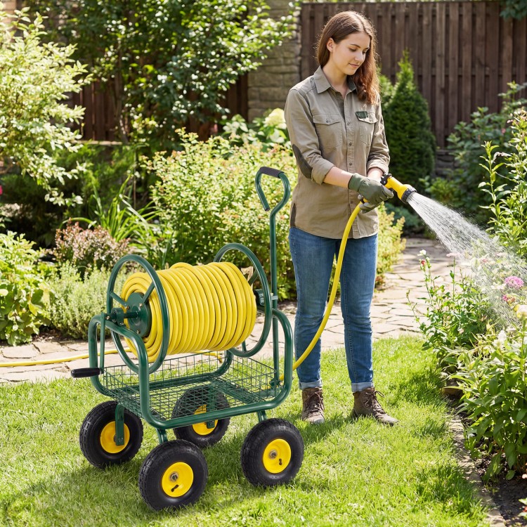 Garden hose reel cart with 300 ft capacity, 4 wheels, and storage basket, perfect for easy watering in the garden.