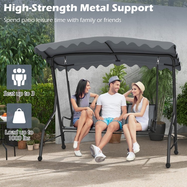 3-seat outdoor porch canopy swing in gray with adjustable shading, robust metal frame, for backyard relaxation.