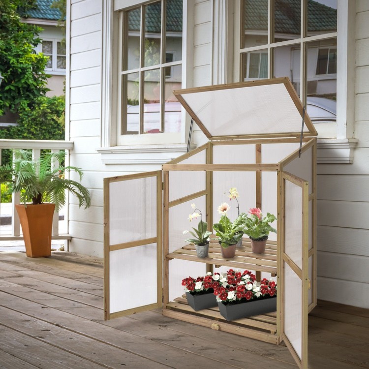 Wooden raised plants greenhouse with two doors and slatted shelves, perfect for protecting flowers in any weather.