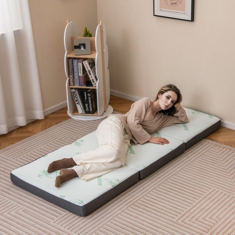 Tri-fold foam mattress in gray, featuring a washable cover, ideal for yoga, guest sleeping, and easy storage.
