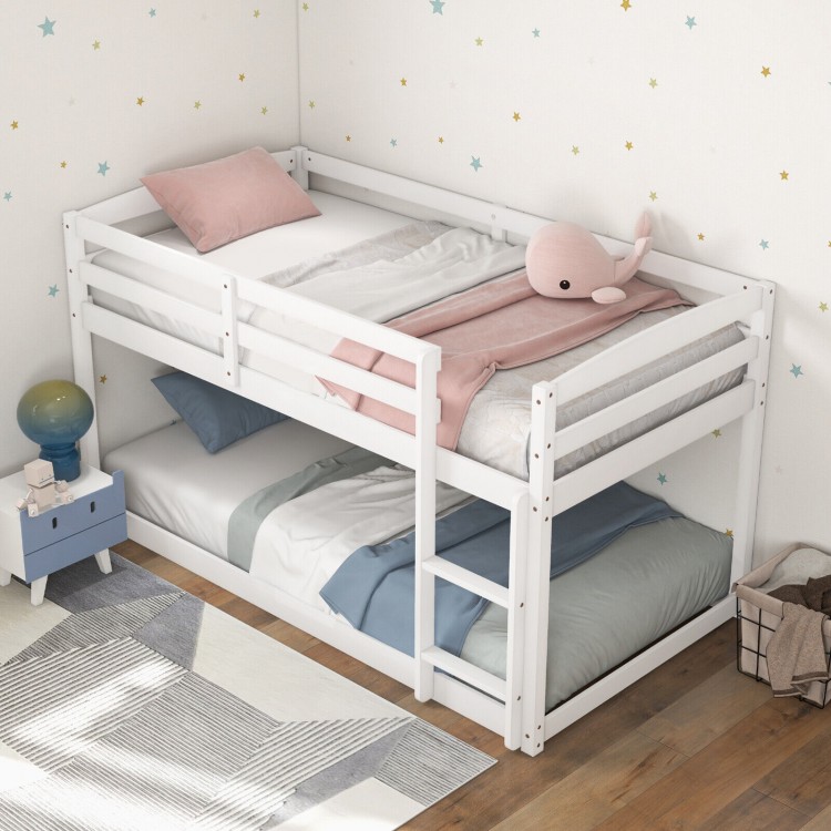 Twin size bunk bed in white with high guardrails and integrated ladder, perfect for kids' rooms and space-saving needs.