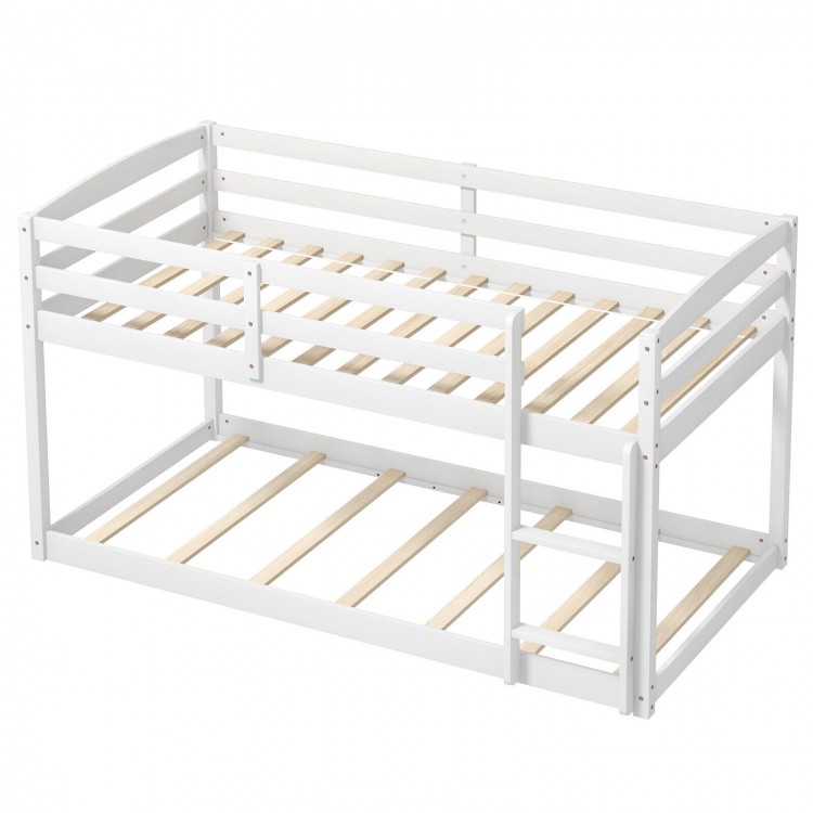 Twin size white bunk bed featuring solid wood slats and high guardrails, perfect for children's rooms or small spaces.