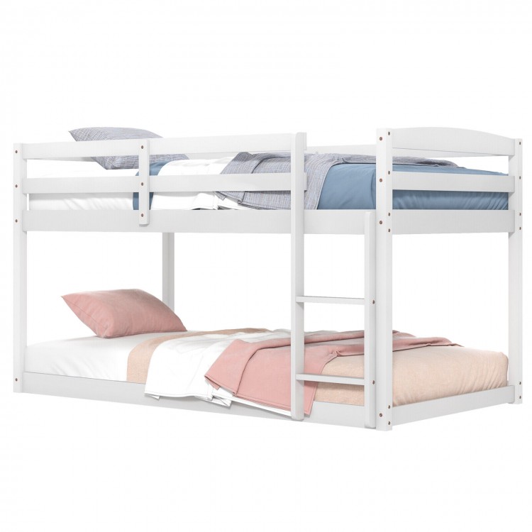 Twin size bunk bed in white with high guardrails and integrated ladder, ideal for kids' rooms and space-saving.