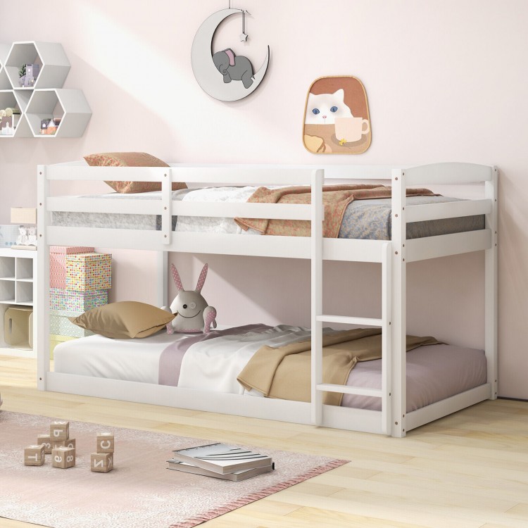 Twin size white bunk bed with solid wood frame and full-length guardrails, perfect for safe and stylish kids' rooms.