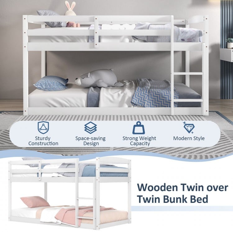 Twin over twin wooden bunk bed in white with high guardrails and integrated ladder, ideal for kids' rooms or dorms.