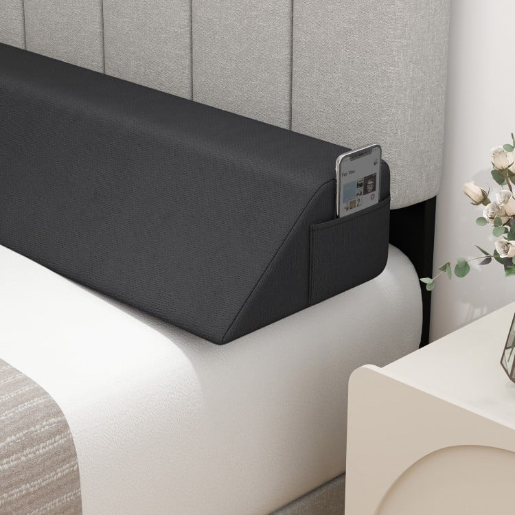 Bed wedge pillow with storage bag, designed to fill gaps and support spinal alignment, perfect for reading and sleeping.