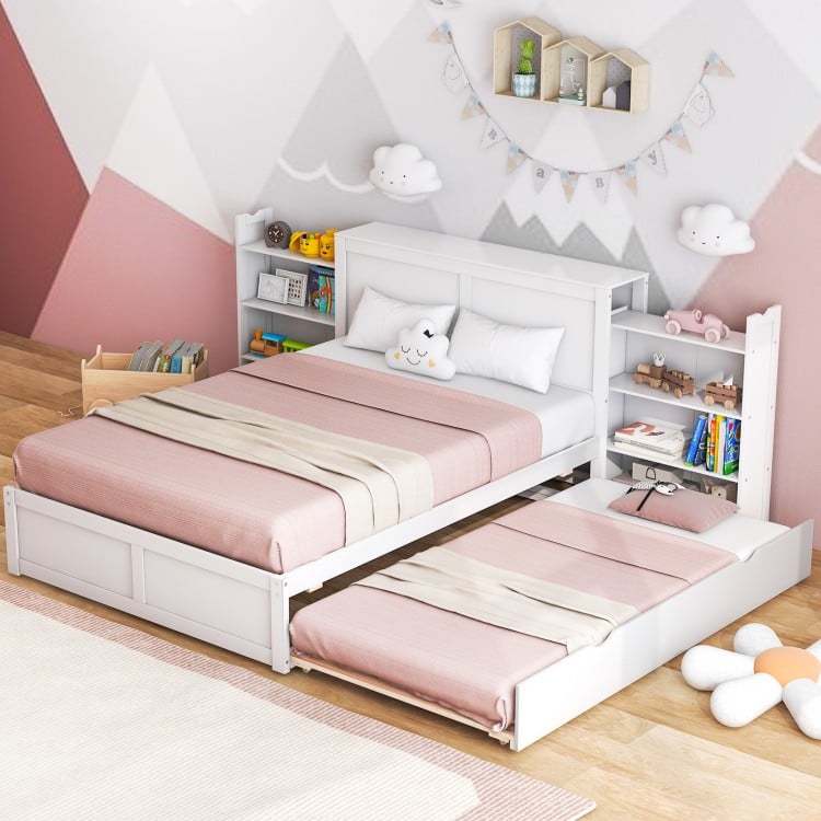 Twin/Full kids wooden platform bed with trundle and storage headboard, featuring a cozy design for sleepovers.