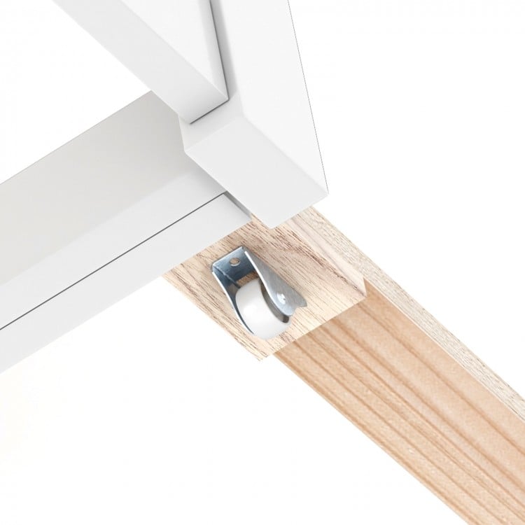 Close-up of the rolling trundle wheel on the Twin/Full Kids Wooden Platform Bed with storage for easy mobility.