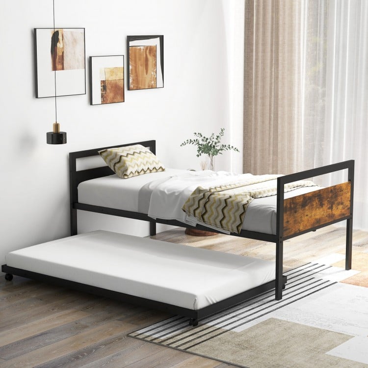 Twin metal daybed with trundle, featuring lockable wheels and industrial design, perfect for bedrooms and guest rooms.