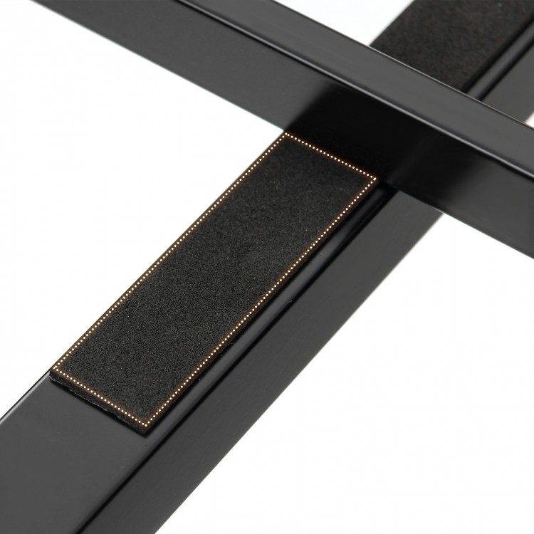 Close-up of the black metal frame's non-slip foot pad, designed for stability and scratch prevention on the bed frame.