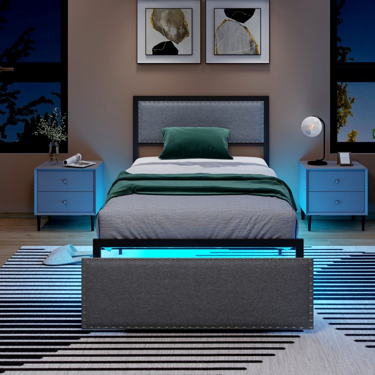 Twin size bed frame with LED lights, upholstered in linen, featuring a rivet-decorated headboard and rolling drawer.