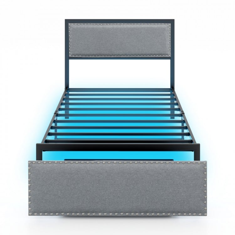 Twin size bed frame with LED lights, upholstered in linen fabric, featuring a rivet-decorated headboard and rolling.