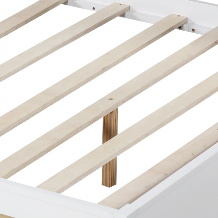 Wooden slats of a twin/full size daybed frame with solid wood legs, designed for stability and support without a box.