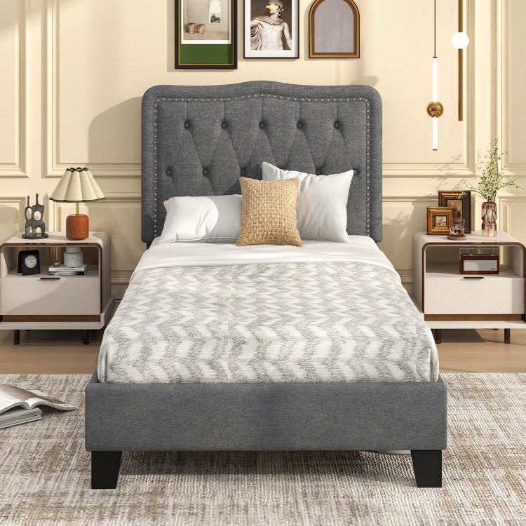 Twin size bed frame with a 46-inch tall gray button tufted headboard, featuring sturdy plywood slats for durability.