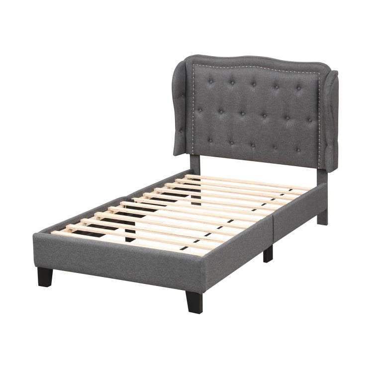 Twin size bed frame with gray button tufted wingback headboard and sturdy plywood slats, ideal for stylish storage.