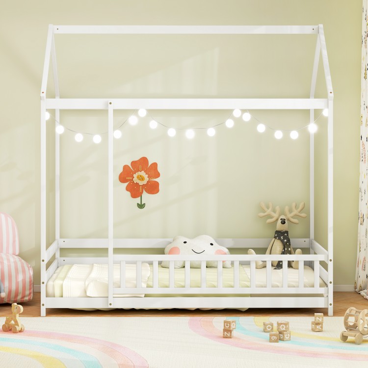 Twin size kids house bed in white with roof, safety guardrail, and decorative lights for imaginative play and sleep.