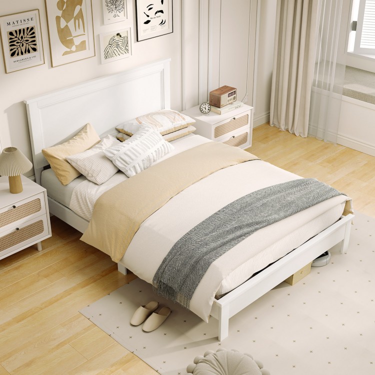 Full size white platform slat bed frame with high headboard, featuring solid rubber wood and stylish bedding for.