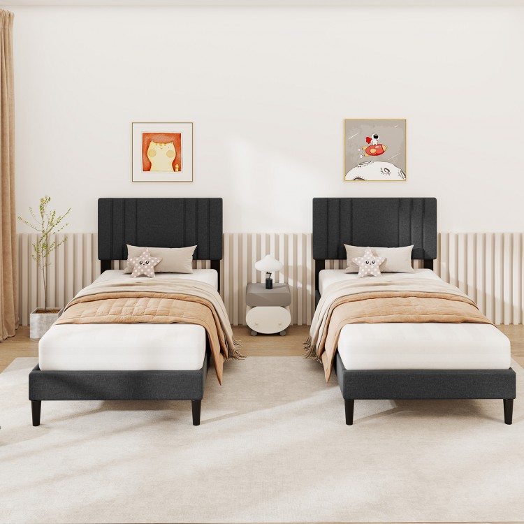 Twin size bed frame with vertical channel tufted headboard in faux linen, featuring wooden slats and modern design.