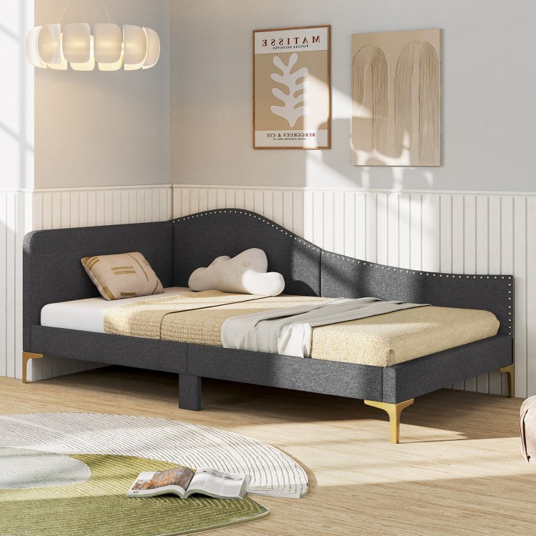 Rivet-tufted platform bed in gray linen with metal legs, ideal as a daybed or sofa for versatile use.