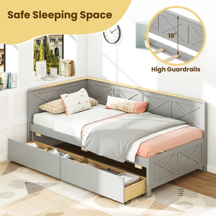 Twin size gray daybed with high guardrails and two storage drawers, ideal for guest sleeping and space-saving.