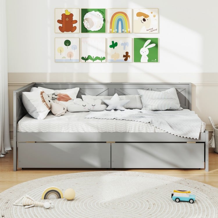 Twin size gray daybed with two storage drawers, perfect for sleepovers and organizing toys in limited space.
