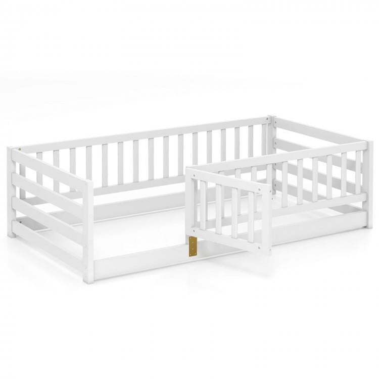 Twin size floor bed in white with high fence and door, crafted from sturdy pine wood for kids' safety and play.
