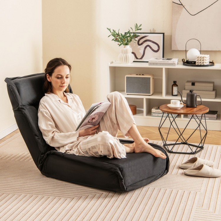 Convertible black folding floor chair with adjustable backrest, perfect for reading, gaming, or relaxing at home.