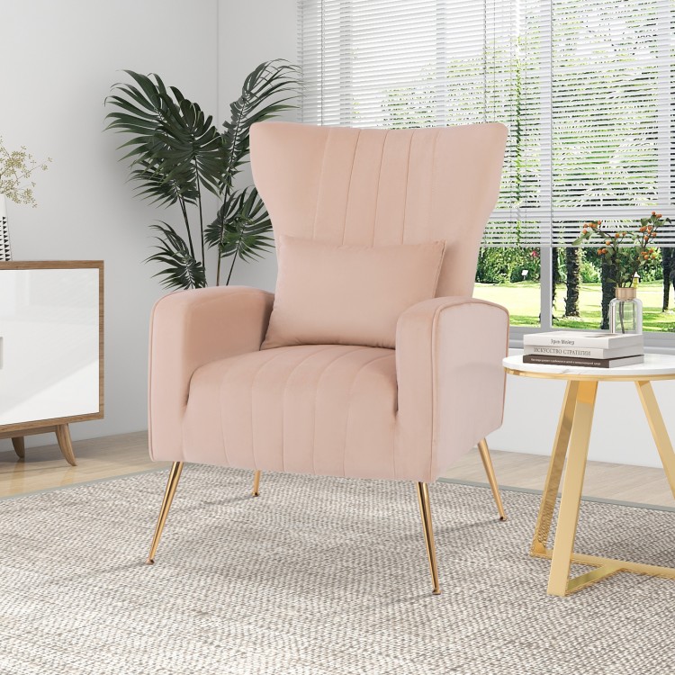 Elegant pink velvet wingback chair with a spacious seating area and golden metal legs, ideal for stylish relaxation.