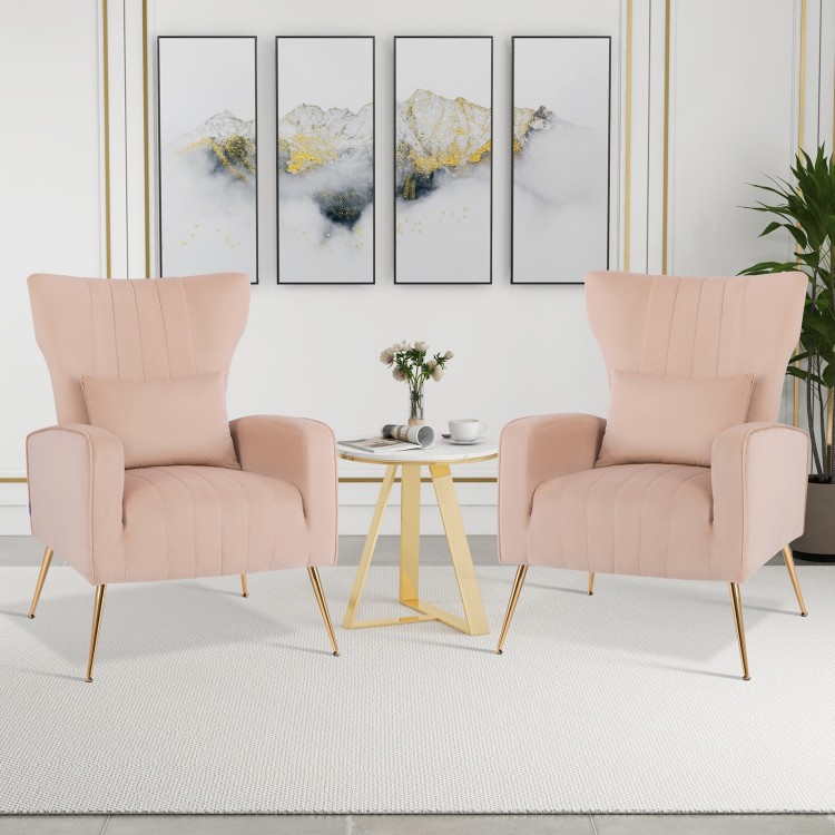 Pink velvet upholstered wingback chairs with lumbar pillows and golden metal legs, perfect for living rooms and.