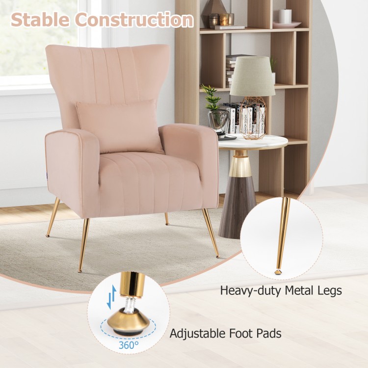 Side view of pink velvet upholstered wingback chair featuring golden metal legs and adjustable foot pads for stability.