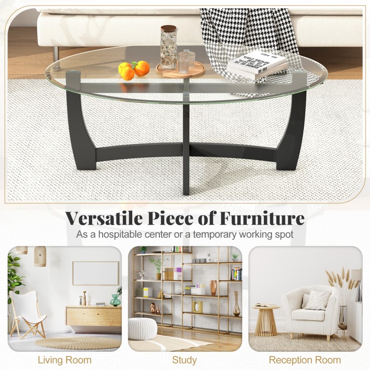 Oval coffee table with tempered glass top and rubber wood legs, featuring an X-shaped base for versatile use in any.