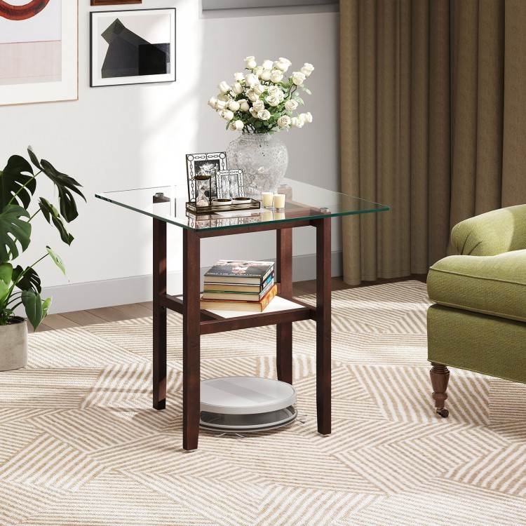 Square glass coffee table with brown rubber wood legs, featuring a storage shelf for versatile home use.