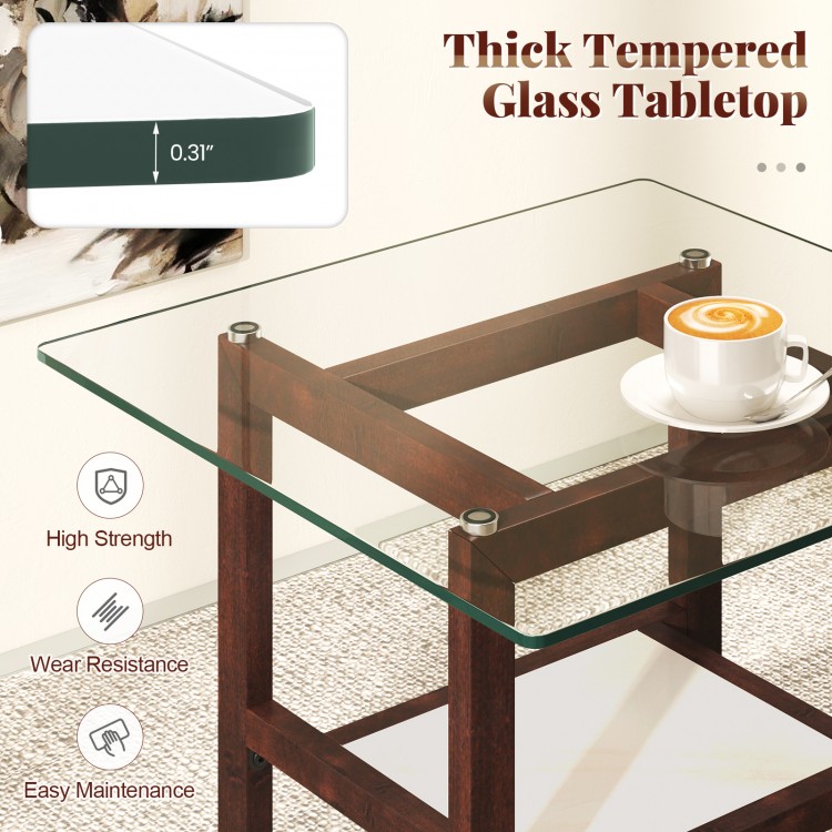 Square coffee table with a thick tempered glass top, brown rubber wood legs, and an open storage shelf for versatile.