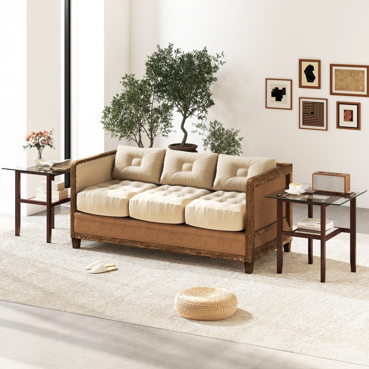 Square glass coffee table with brown rubber wood legs, featuring a storage shelf, perfect for versatile home use.