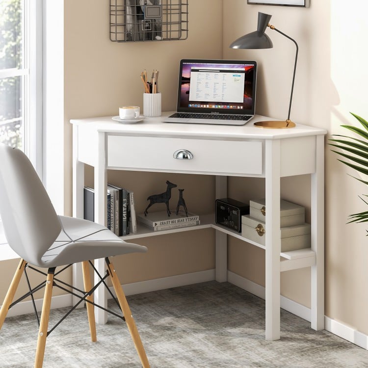 Corner wooden laptop desk in white with a drawer and two shelves, perfect for home office or study use.
