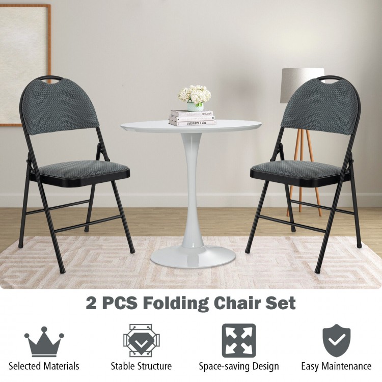 Two padded folding office chairs with backrests and a round table, featuring a space-saving design for easy storage.