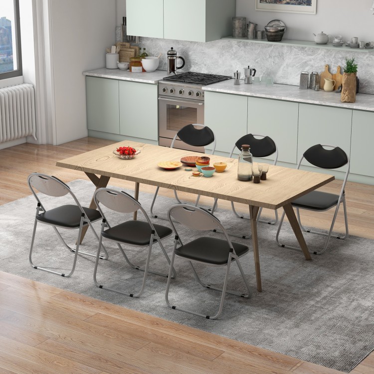 U-shape folding chairs arranged around a wooden table, ideal for gatherings, featuring soft seats and hollow handles.