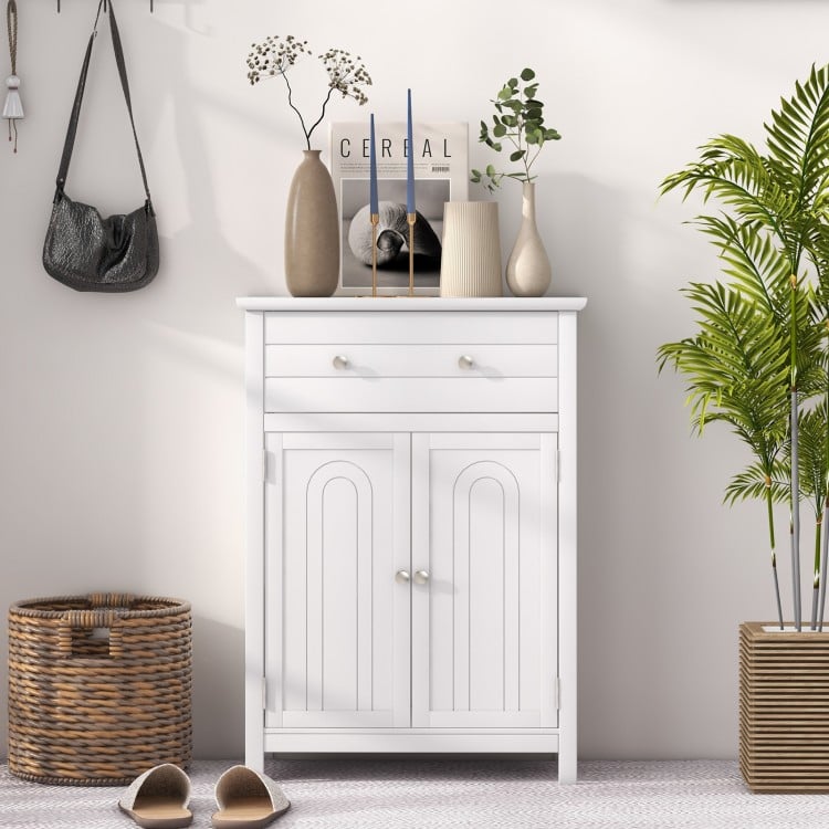 Free standing bathroom storage cabinet in white with large drawer and adjustable shelf, perfect for home organization.