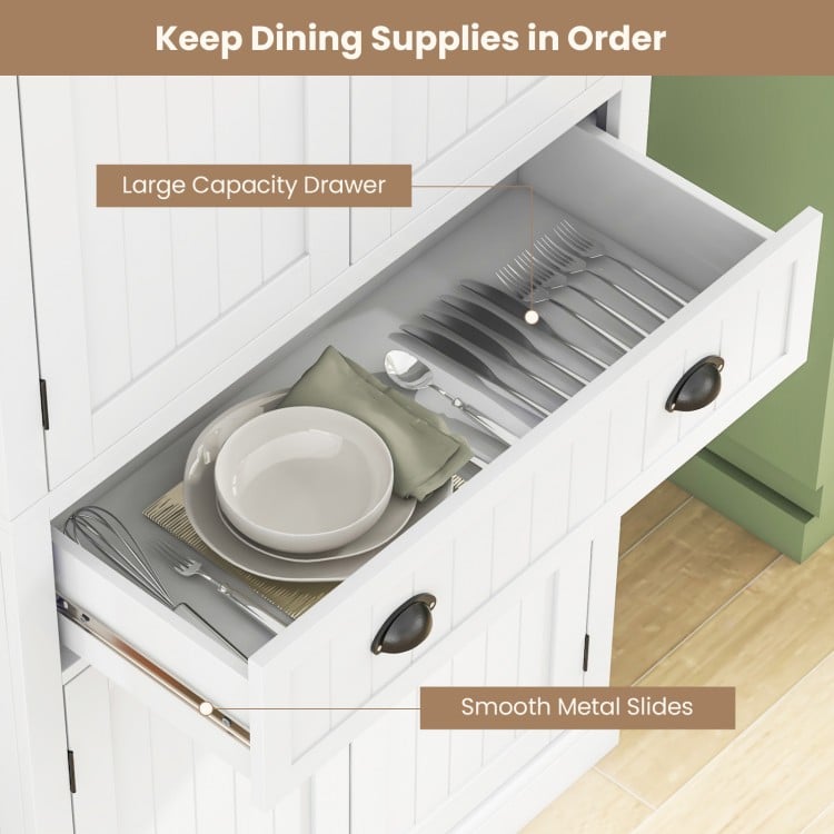 Large capacity drawer of a white kitchen pantry cabinet, featuring smooth metal slides and organized dinnerware storage.