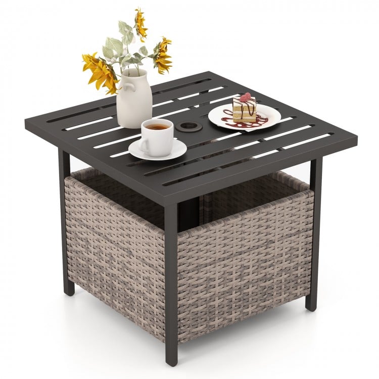 Gray outdoor patio side table with PE rattan storage, steel frame, and umbrella hole, perfect for deck relaxation.