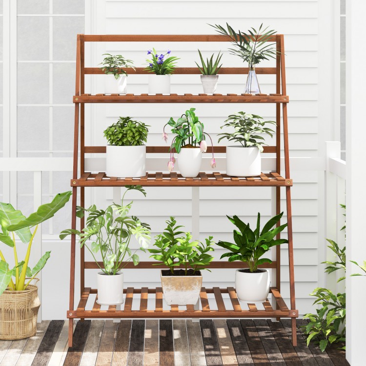Three-tier bamboo ladder shelf in brown, ideal for displaying plants indoors or outdoors with a foldable design.